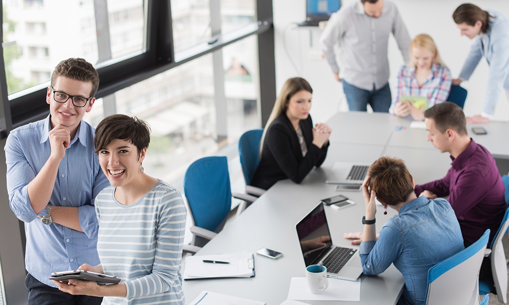 A diverse team of professionals collaborating in a modern office environment.